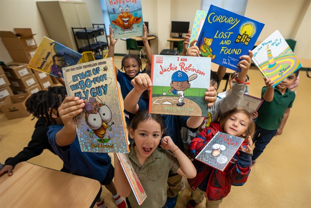 Kindergarteners receive books at Tyler ISD’s Douglas Elementary